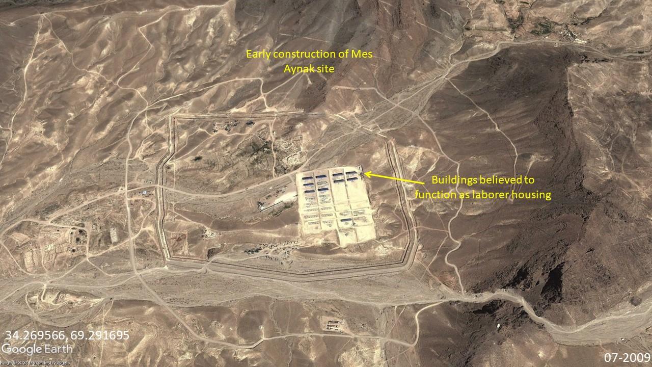Mes Aynak copper mine in 2009. The construction of housing for workers was visible in the center of the camp in the large square, and construction materials for other buildings were seen strewn about.