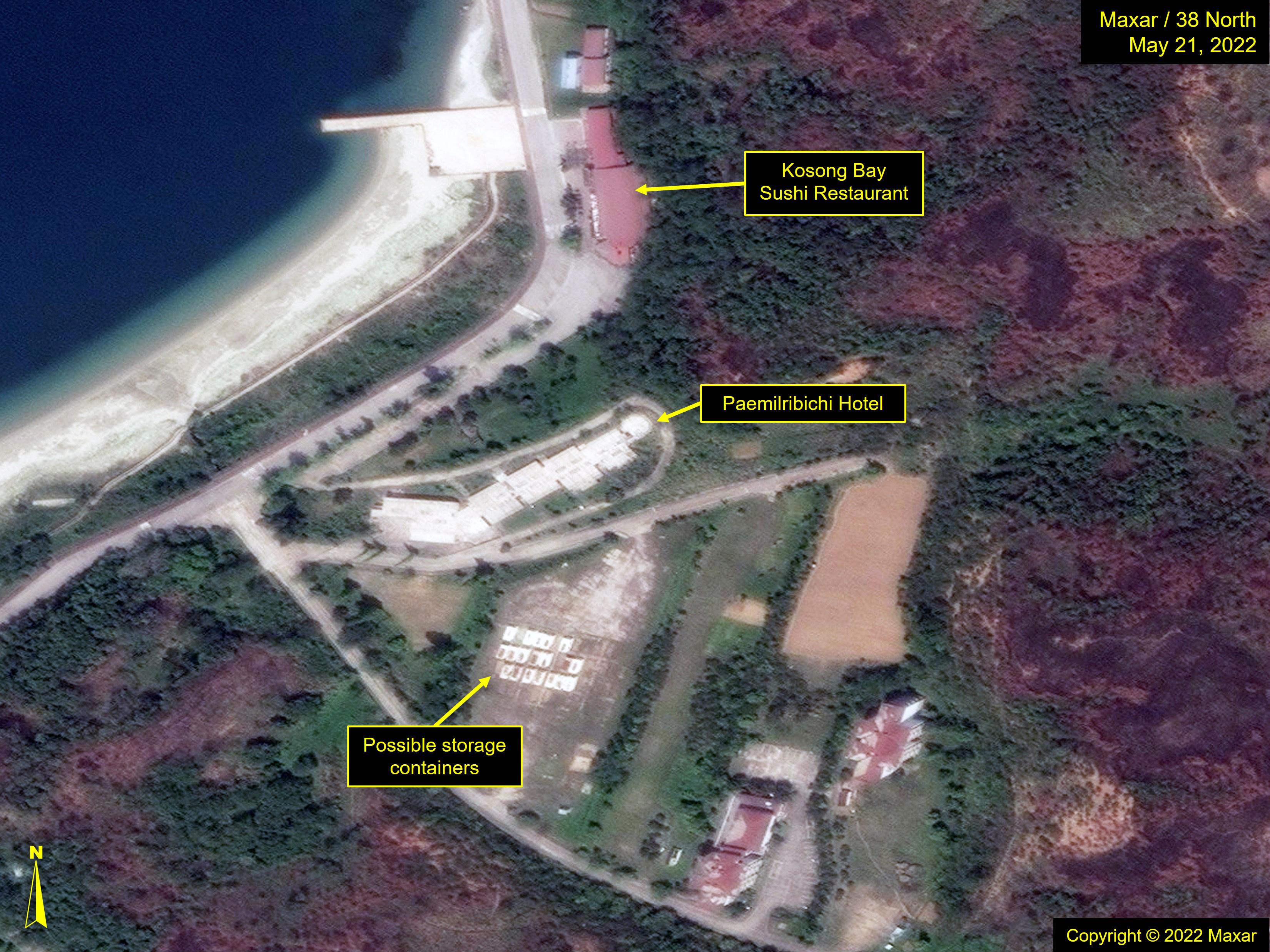 Figure 10. Kosong Bay Sushi Restaurant prior to razing. Cargo containers or caravans seen nearby with rust on their roofs.