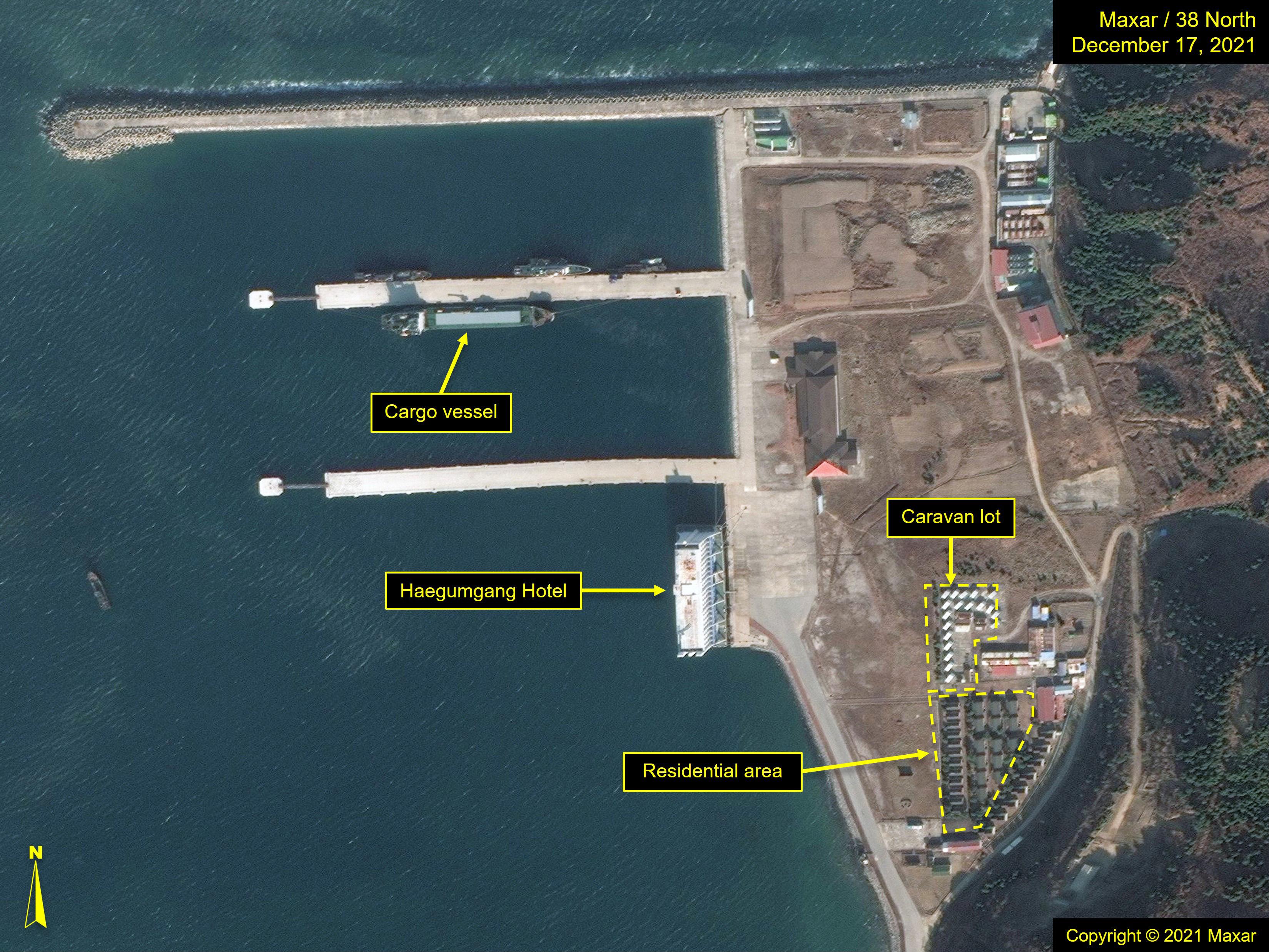 Figure 4. Imagery from December 2021 shows the Haegumgang Hotel and the surrounding area prior to demolition. A cargo vessel is also seen at one of the piers.