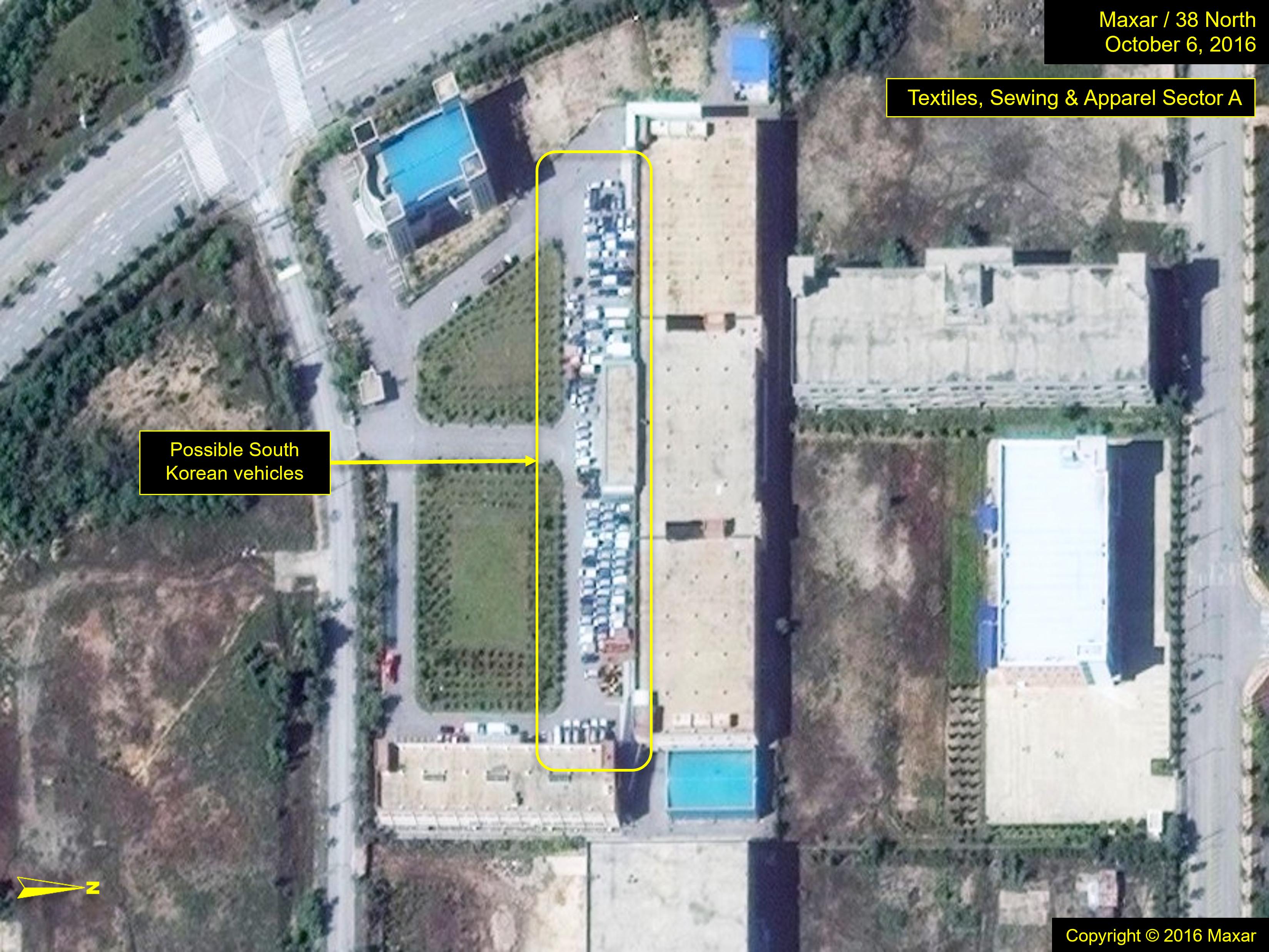 Figure 8a. Vehicles, possibly belonging to South Korean workers, assembled outside a building in the textiles, sewing and apparel sector on imagery from October 2016.